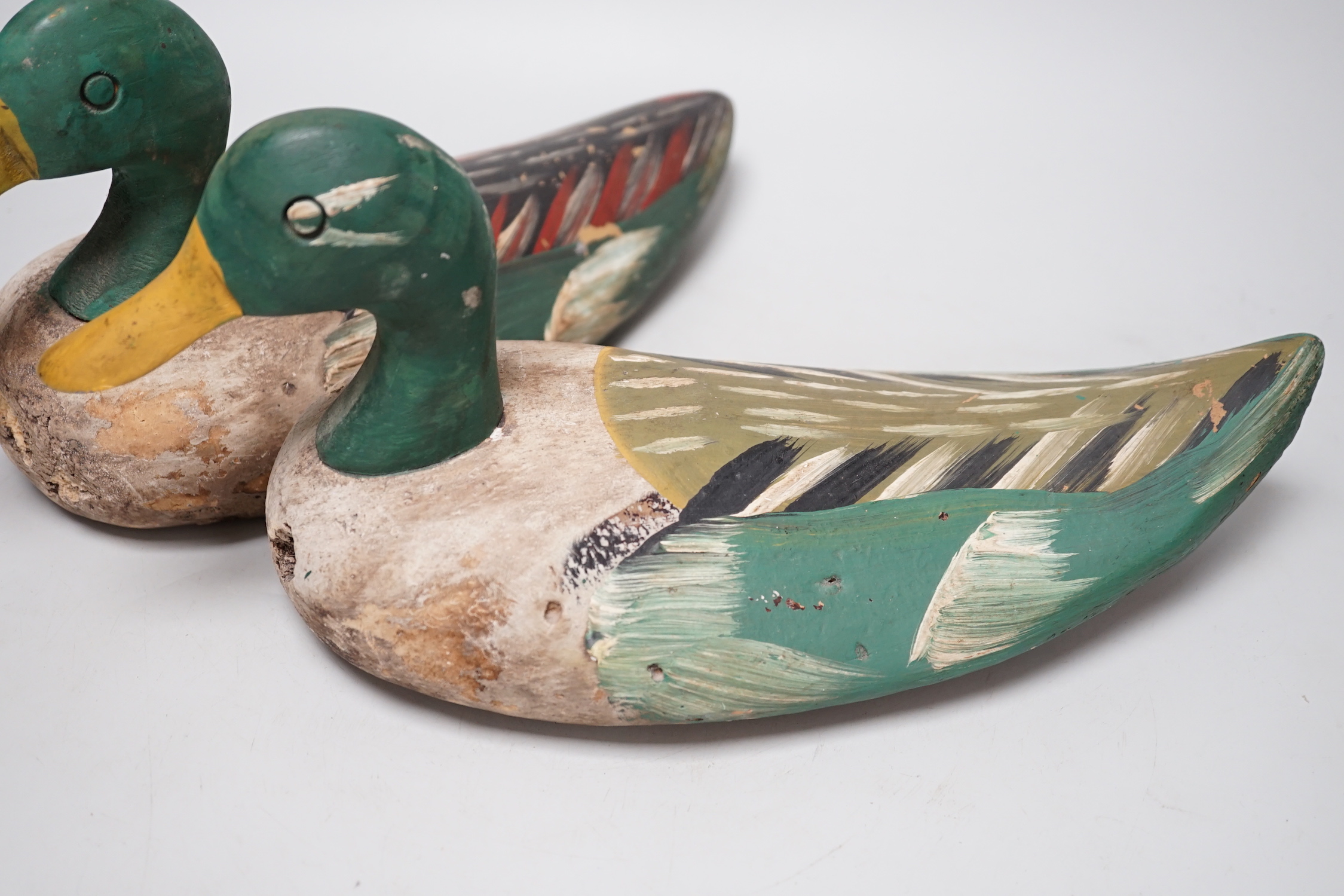 Two painted wood decoy ducks, 33cm long